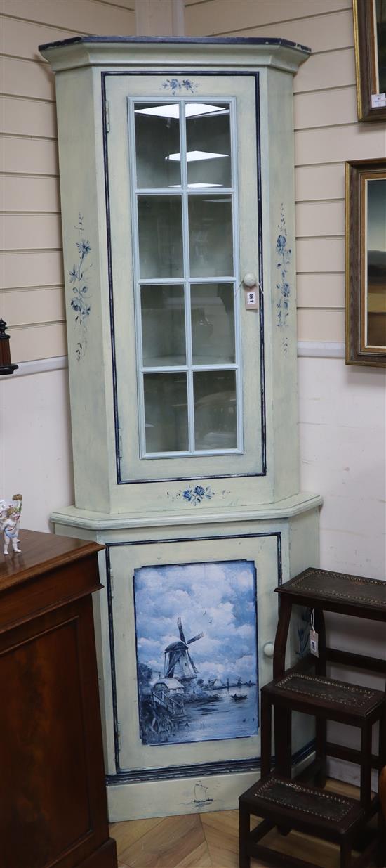 A painted Dutch style standing corner cabinet H.216cm